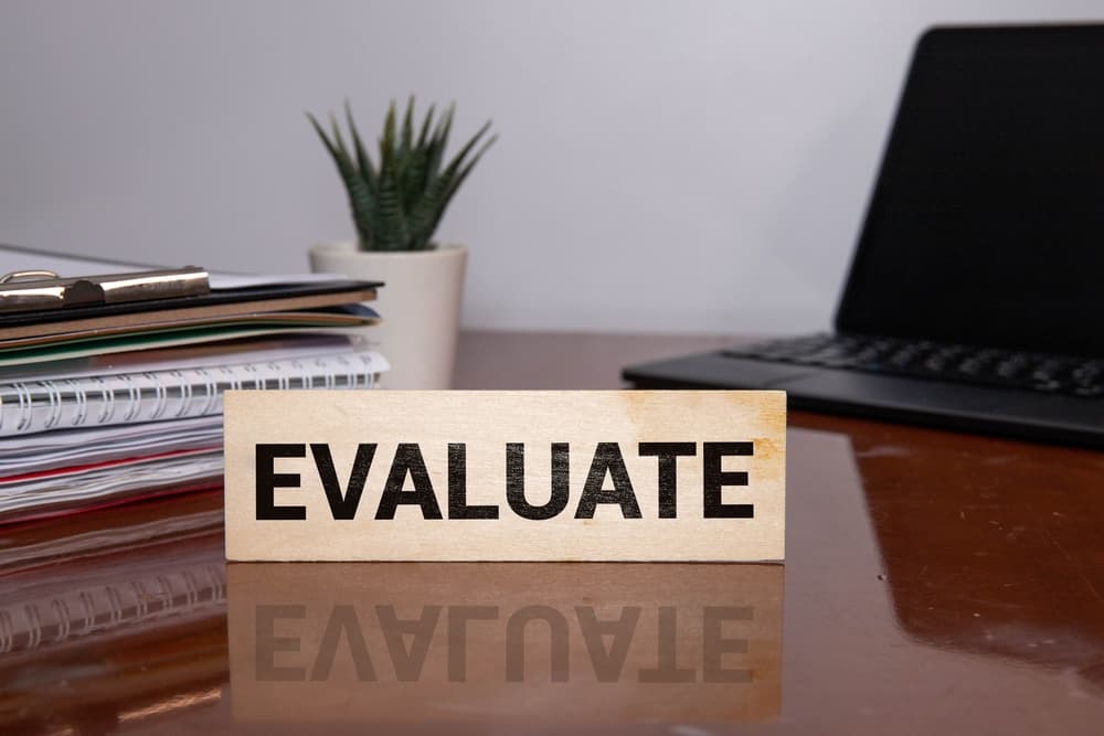 evaluation word written on wood block.